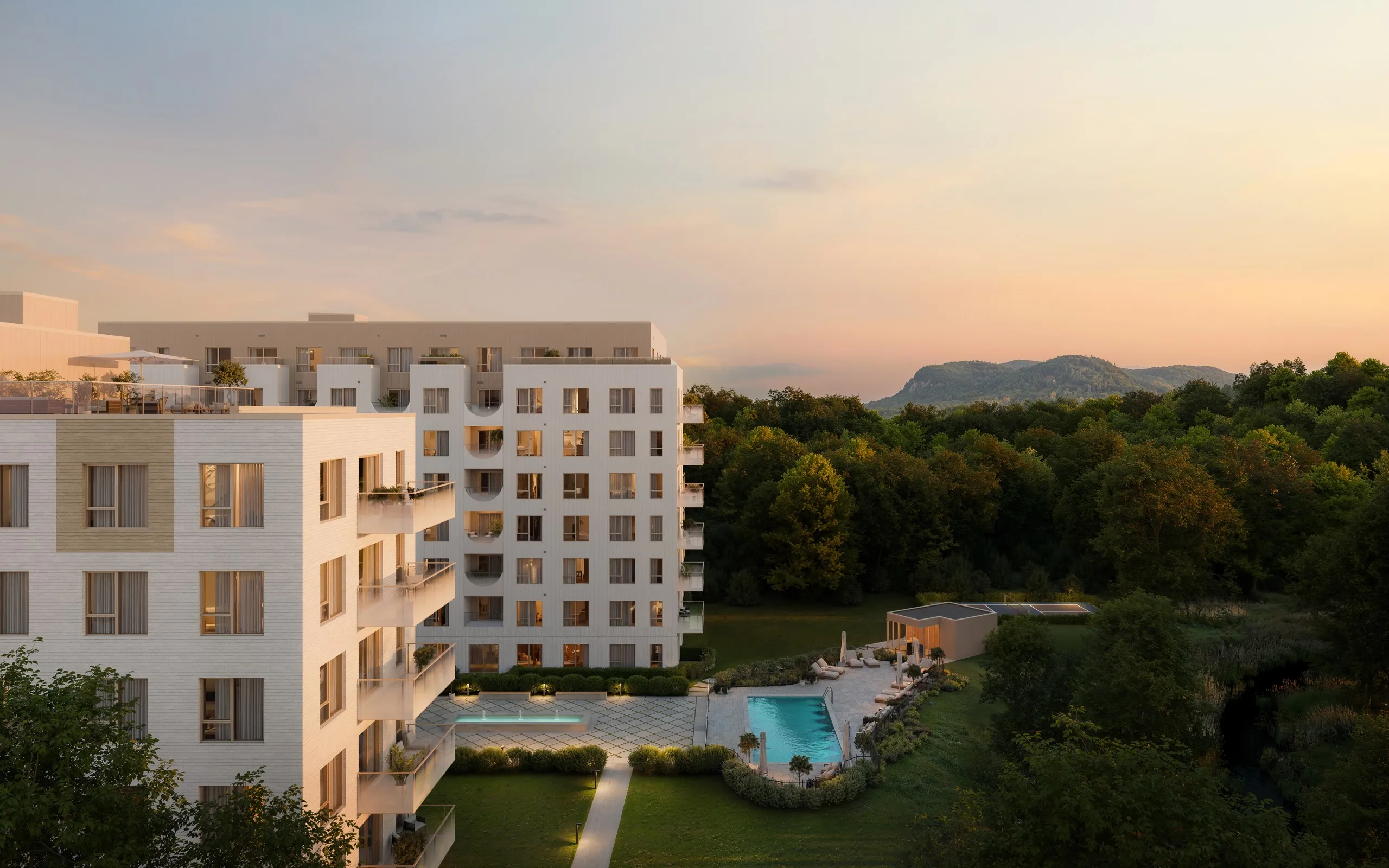 Vue sur les bâtiments Riviera et la piscine au coucher du soleil